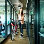 businesswoman arriving to work on bike