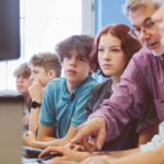 group of high school students learing programming